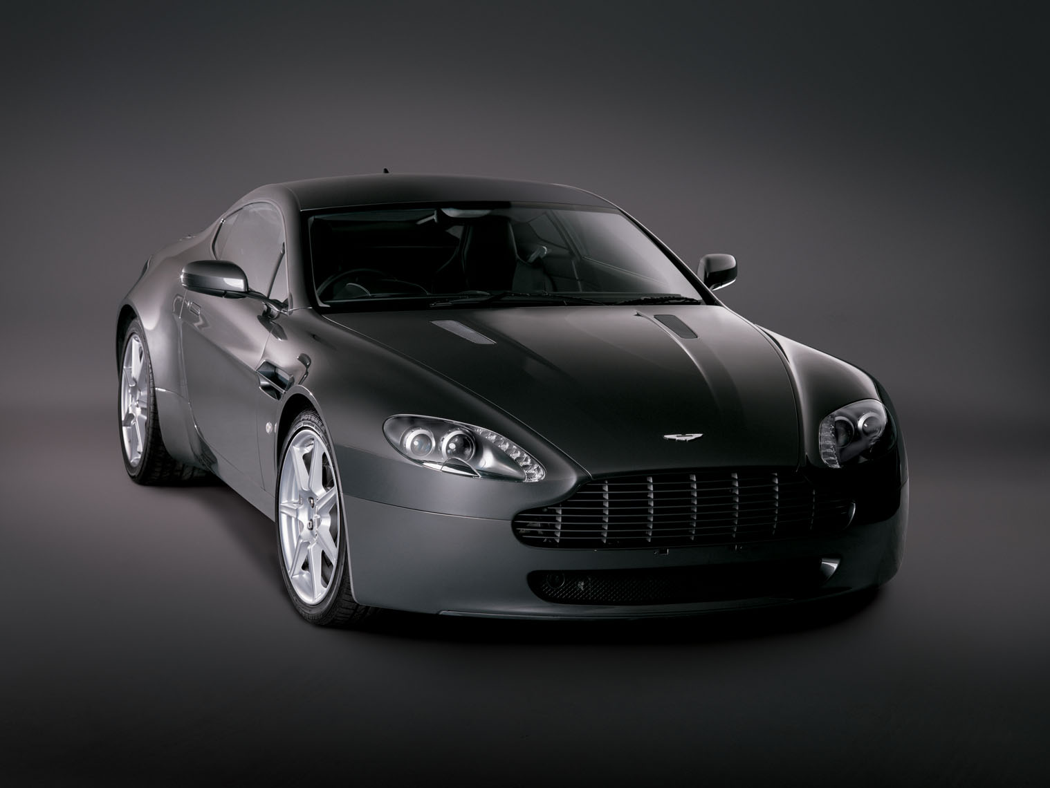 Grey Aston Martin studio photograph.