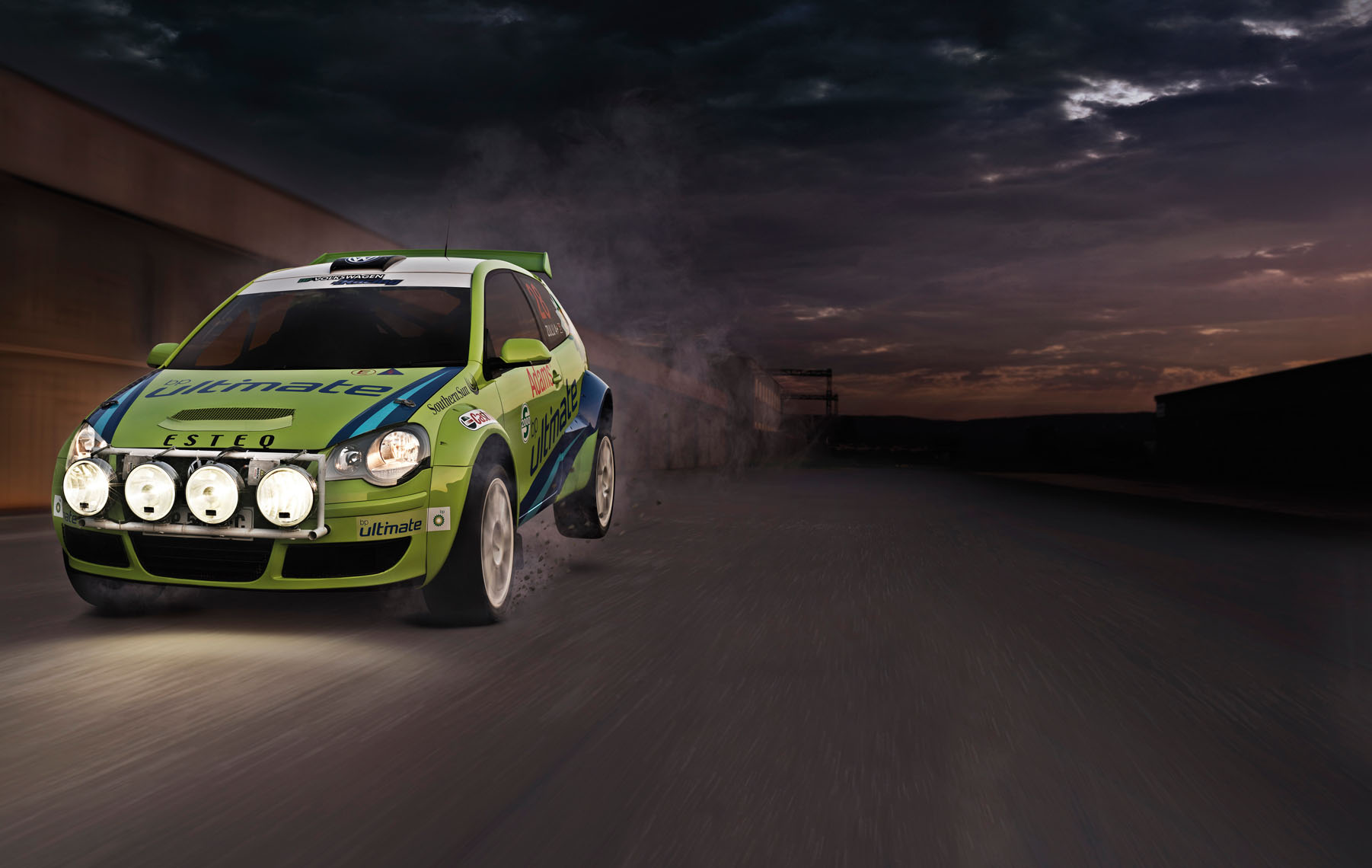 BP energy rally car, ramping on track,  in the early evening. 