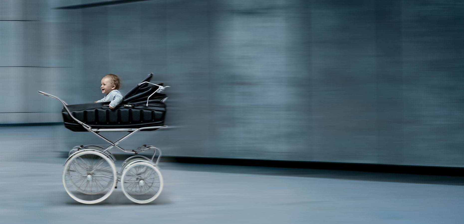  A baby in a pram zooming along at top speed. 
