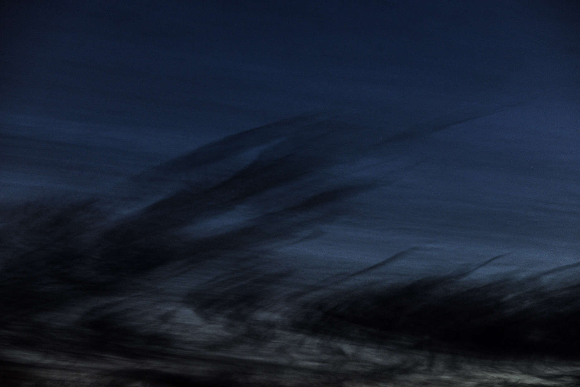 Interesting, dark spiky cloud formations photographed at twilight. 