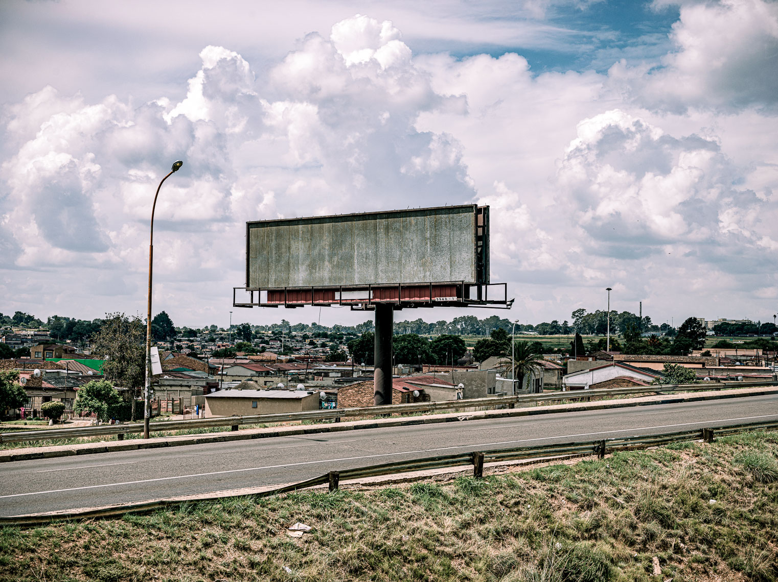 Empty billboard next to a motorway. 