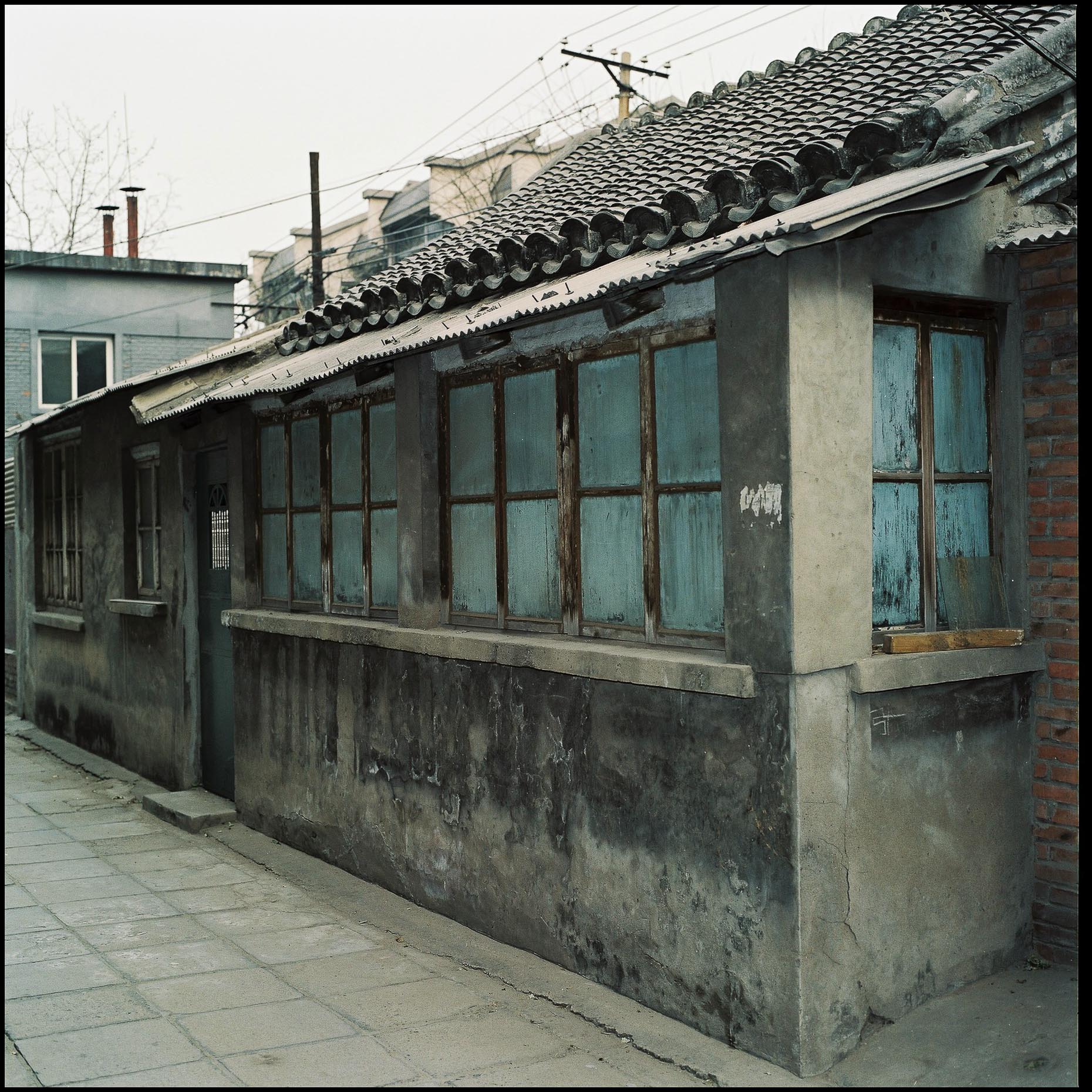 A typical grey,  haphazardly constructed house in the Hutongs of Beijing. 