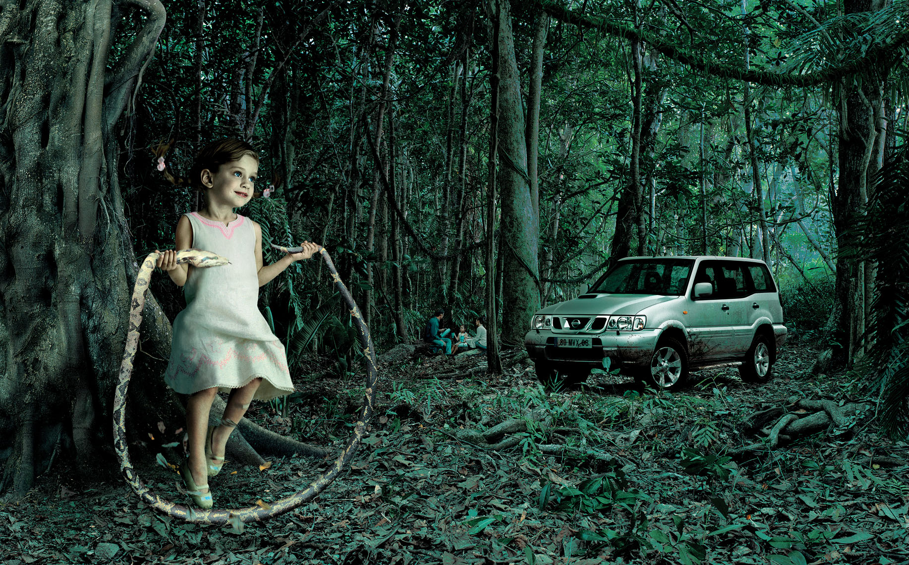  A young girl skipping with a snake in a forest with a Nissan Terrano parked in the background. 