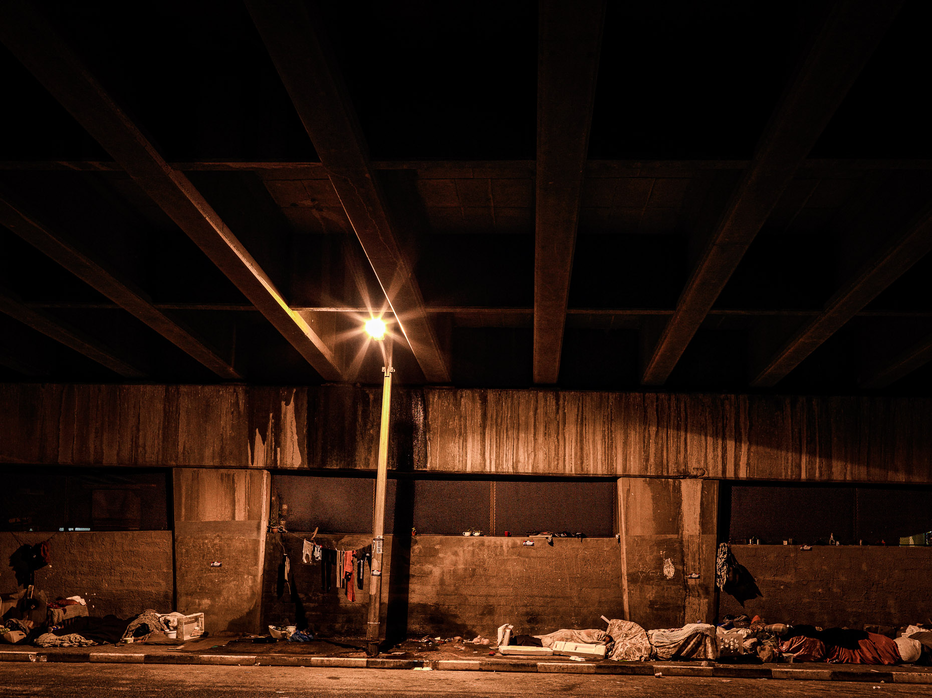 Under the Woodstock Bridge, downtown Cape Town, at night, and home to a transgender community.