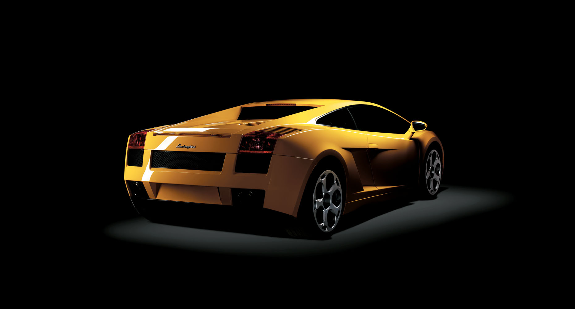  A back shot of a yellow Lamborgini photographed in a studio on a black background. 