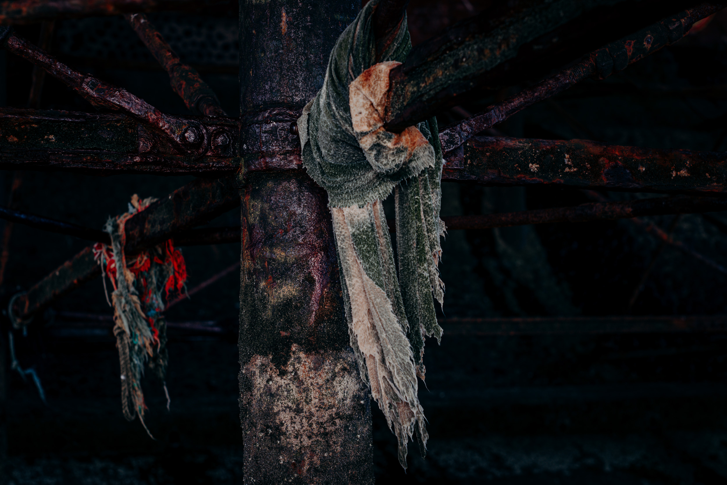 Tattered  textile waste washed-up from the sea , entangled underneath the Blackpool pier. 